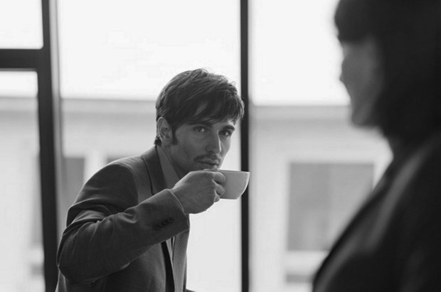 abusinessmandrinkingcoffeeinthecanteen